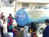 Local women filling water from supply tank 